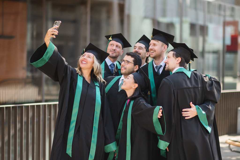 MBA graduates taking a selfie
